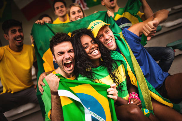 istock brazilian supporters have fun at the stadium 989197458