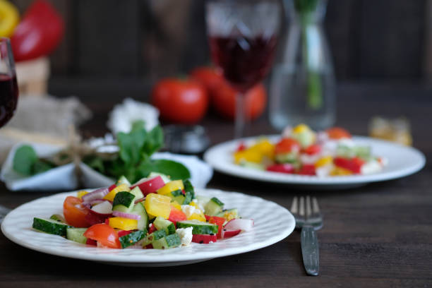 istock two servings of salad from vegetables, dinner for two 989202584