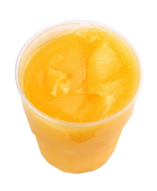 istock yellow honey in plastic figured container isolated on white background at dry sunny day 989209392