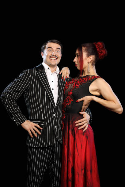 istock Beautiful young couple on a black background 989213406