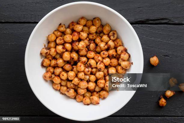 Chickpeas With Spice In Bowl On Black Background Close Up Top View Image Stock Photo - Download Image Now