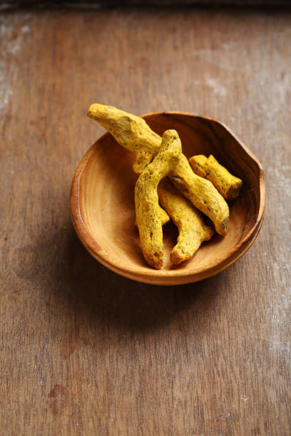 istock Yellow roots of turmeric, curry ingredients 989214200
