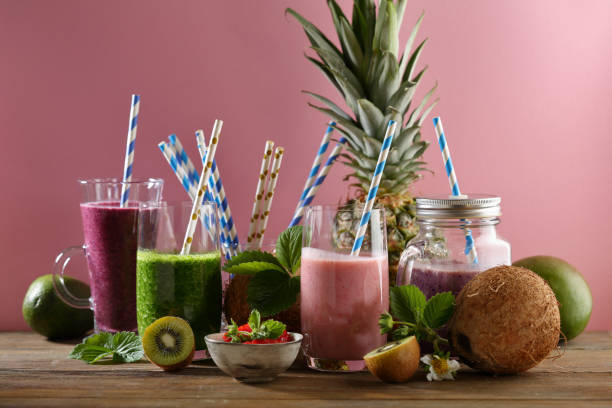 istock Set of summer drinks on pink background, tropical 989214288