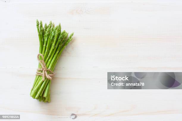 Fresh Asparagus On White Wood Background Stock Photo - Download Image Now - Asparagus, Green Color, Wood - Material