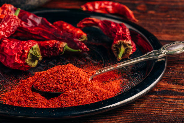 istock Ground and dried red chili peppers 989228312