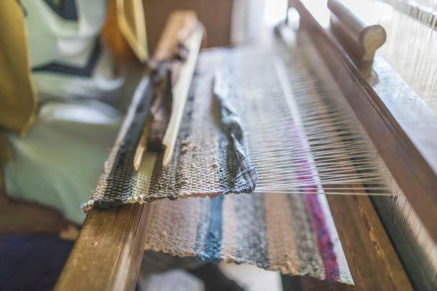 istock Rug manufacturing with old weaver 989229158