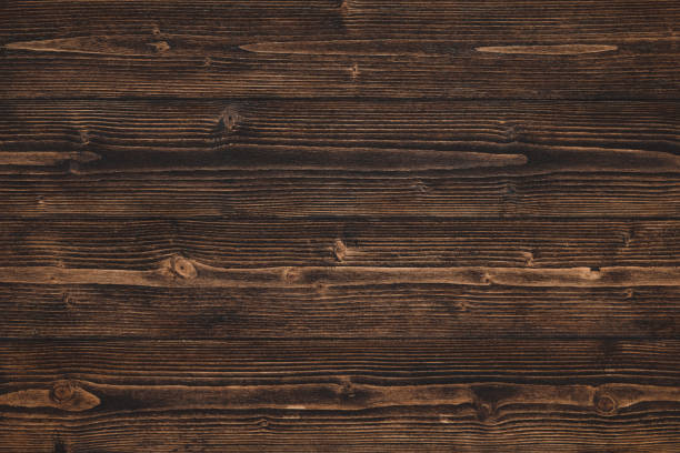 istock Dark brown wood texture with natural striped pattern background 989233126