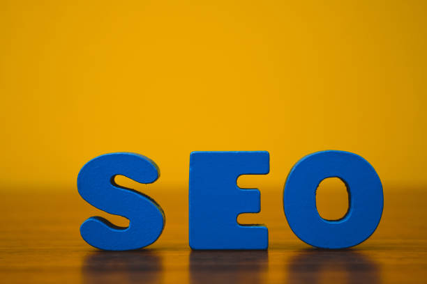 istock SEO text alphabet for Search Engine Optimization concept on wooden working table, business SEO idea. 989233196