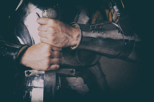 istock knight wearing armor and holding two-handed sword 989261238