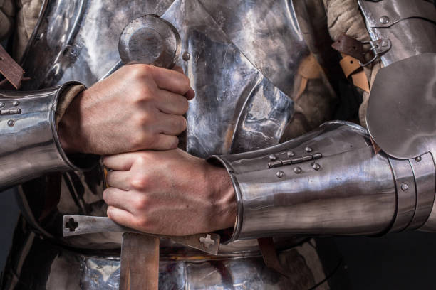istock knight wearing armor and holding two-handed sword 989261262
