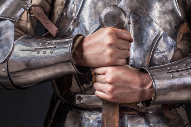 istock knight wearing armor and holding two-handed sword 989261266