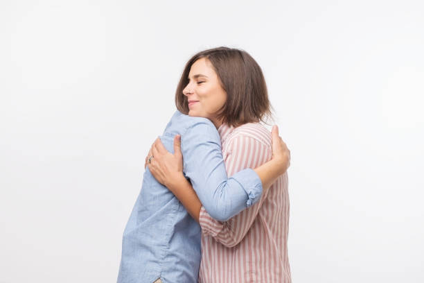 istock European mother and daughter hugging each other. 989265352
