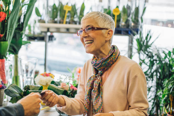 istock Florist handing over a credit card to a customer 989266862