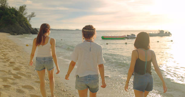 istock Young people having fun on the beach. 989284144