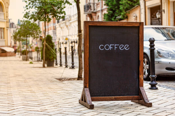 Chalkboard menu sign mockup in modern city, food and drink concept. copy space