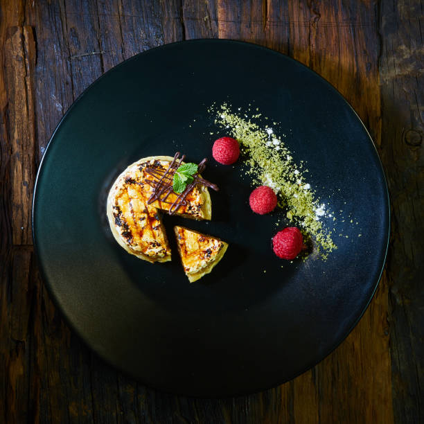 istock Slice of vanilla cheesecake decorated with apple topping 989291738