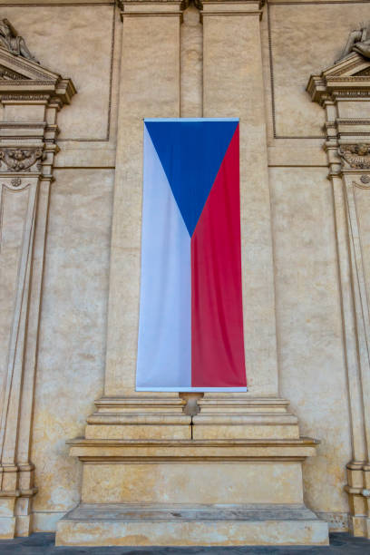 istock National flag of Czech Republic. Placed vertically oriented on the wall 989293634