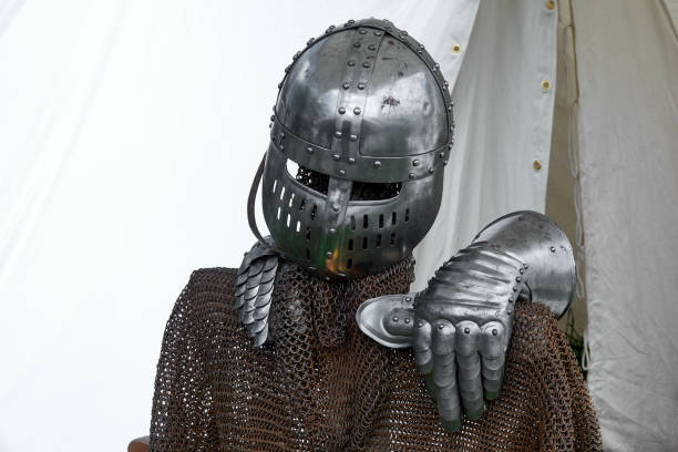 istock Knight helmet and iron hand at the tent 989296616