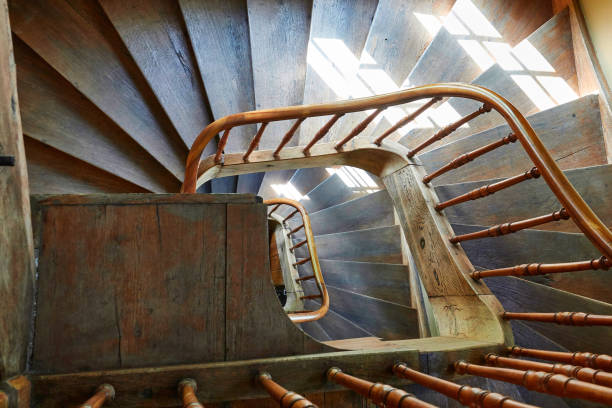 istock Looking down the old wooden staircase 989296790