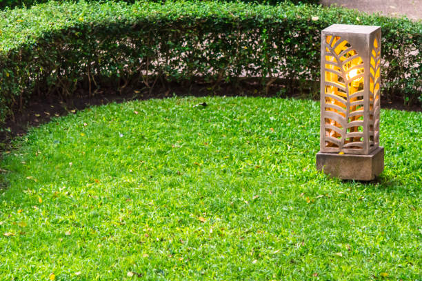 istock Carved stone lamp decoration in garden. 989301016