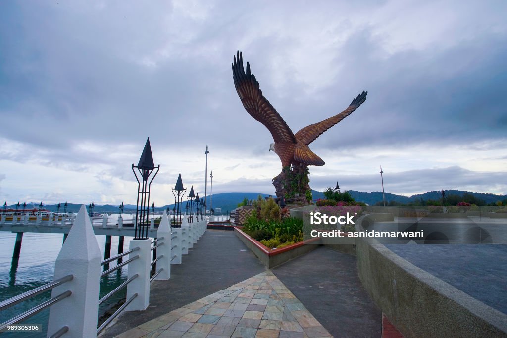 Beautiful sunset at Eagle Square, Dataran Lang is one of Langkawi’s best known man-made attractions, a large sculpture of an eagle poised to take flight. Animal Stock Photo