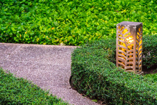 istock Carved stone lamp decoration in garden. 989307474