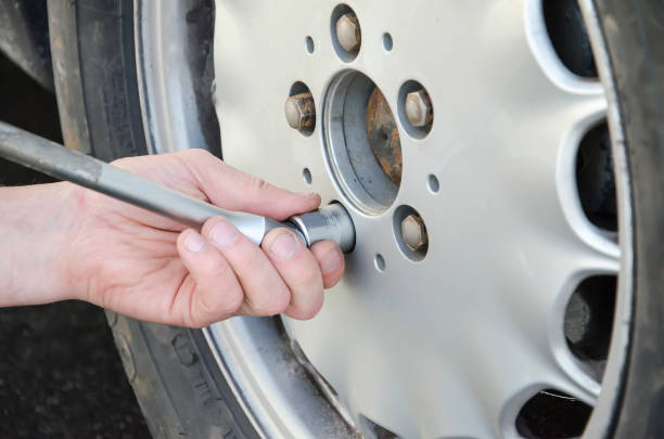 istock wheel installation in the car 989320356
