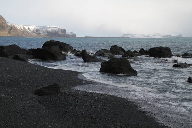 istock Black sand Reynisfjara Beach near Vik in Iceland. 989321516