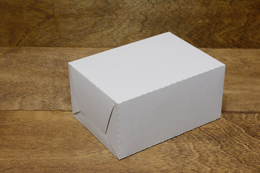 white cardboard box on a wooden background