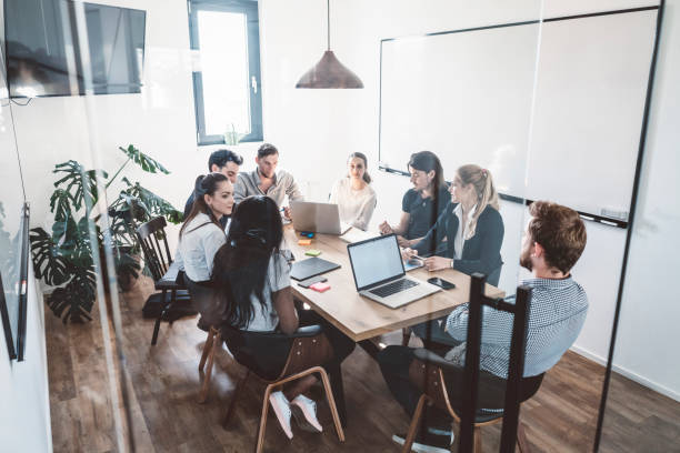 istock Group of young lawyers working at the office 989329028