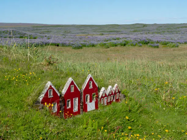 Little red elves houses in Iceland where the Huldufólk live.