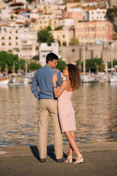 istock Rear view of a couple at boat dock 989344038