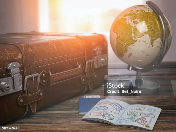 Travel Or Turism Concept Old Suitcase With Open Passport With Visa Stamps And Globe Stock Photo - Download Image Now