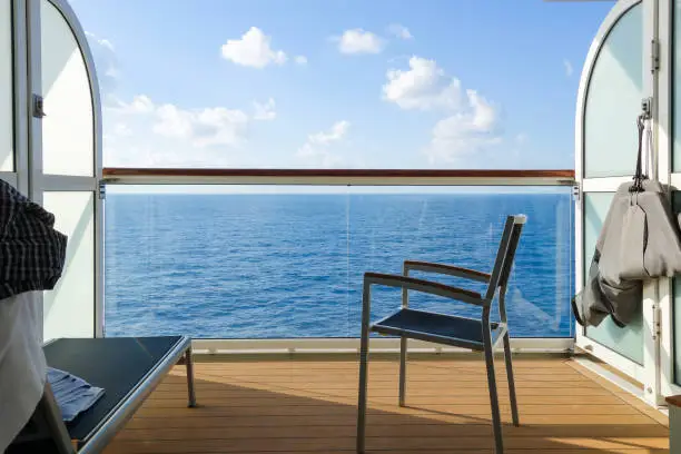 Photo of Empty Chair On Boat Deck Of Cruise Ship Against Sky