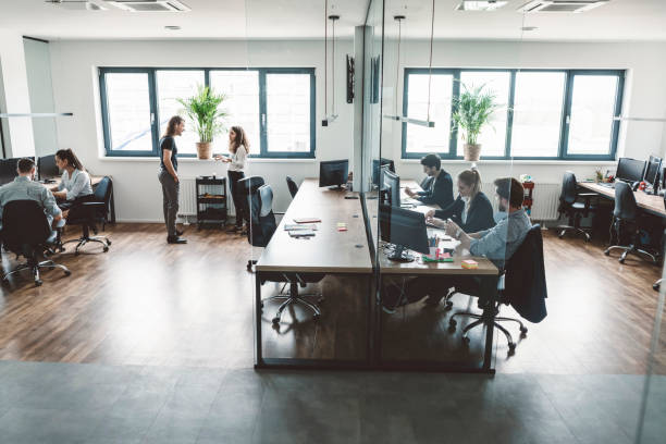 istock Business colleagues talking in meeting room 989359510