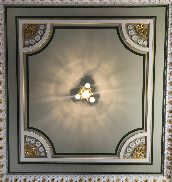 istock Ceiling decoration with a lamp in the center 989365386