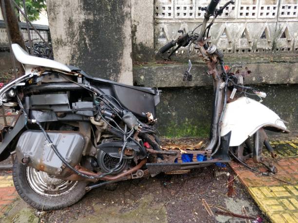 istock Rusted old motorcycle on the ground 989369998