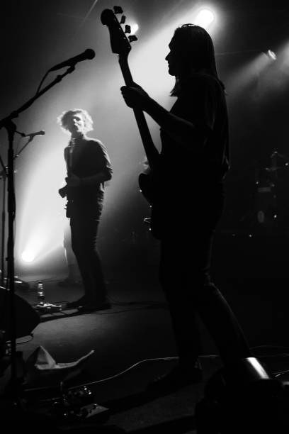 istock Yonung rock band in action on stage 989375690