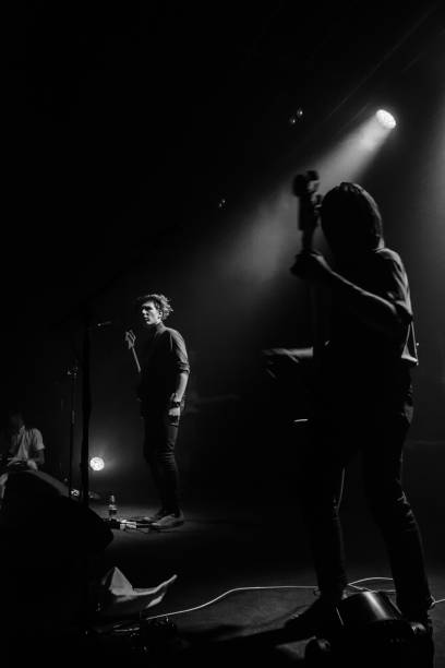 istock Yonung rock band in action on stage 989376082