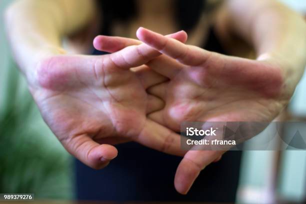 Woman Cracking Their Knuckles Stock Photo - Download Image Now - Knuckle, Cracked, Bone