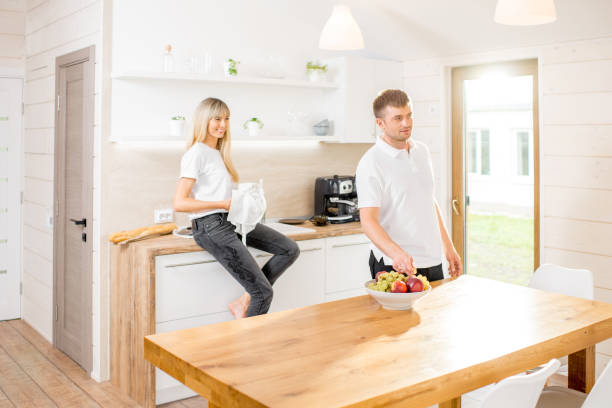 istock Couple at the dinning room at home 989380082