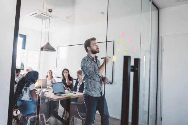 istock Young business people having an important meeting 989397182