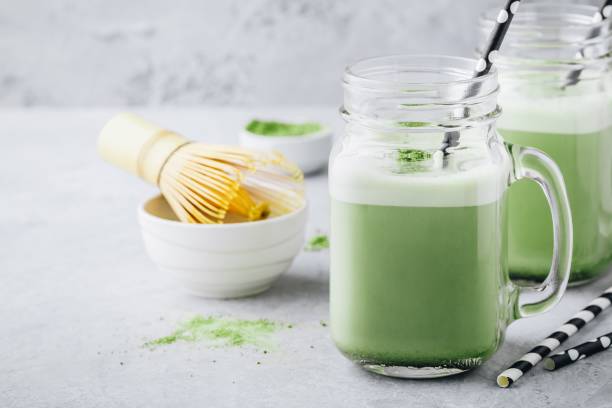 istock Vanilla Green Tea Matcha milkshake in mason jar 989405358
