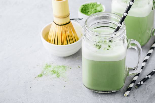 istock Vanilla Green Tea Matcha Latte in mason jar 989407466