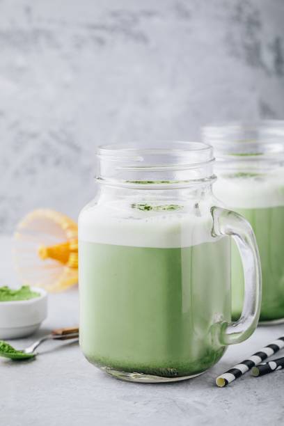 istock Vanilla Green Tea Matcha Latte in mason jar 989407564