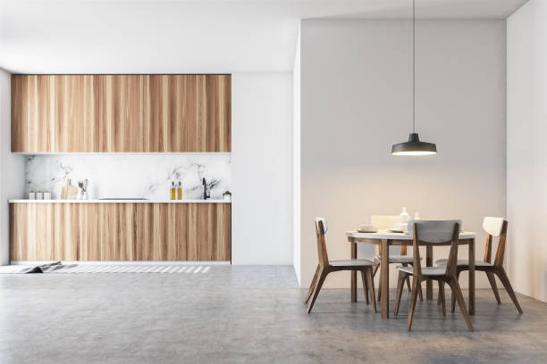 istock Wooden and gray dining room and kitchen 989414892