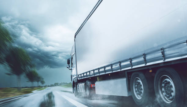 istock Truck driving in the rain 989429678
