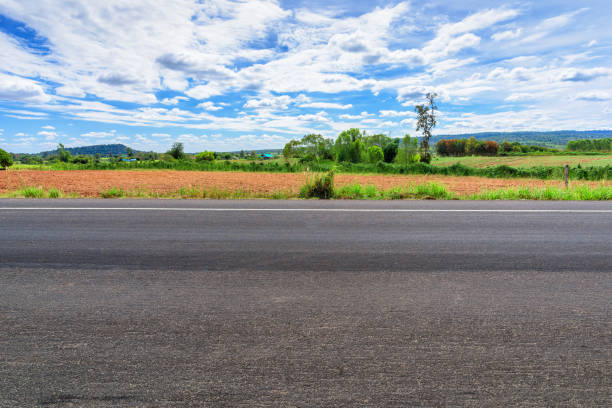 istock Asphalt road side view and landscape countryside. 989431102