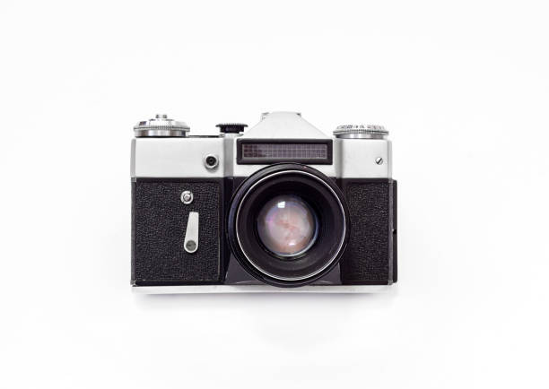istock Vintage film camera, close-up on a white background, top view 989432826