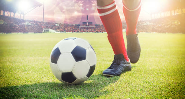 istock Low Section Of Man Playing On Soccer Field 989445692